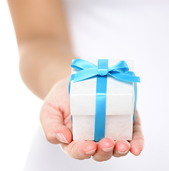 Hand with gift box in palm